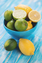 Still life of lemons and limes, vertical shot