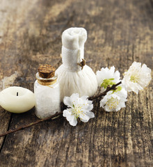 cherry spring flower with massage ball, candle on old wood