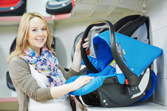 woman choosing child car seat