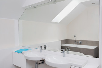 Luxury bathroom with huge mirror