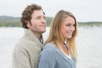 Side view of a relaxed young couple at beach