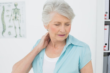 Senior woman suffering from neck pain
