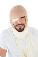 Close-up portrait of a man with head tied up in bandage