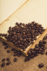 Coffee beans and open book