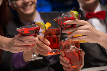 close-up of hands with glasses