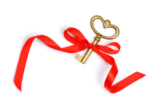 golden key with red ribbon