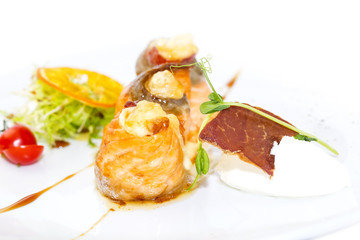 baked salmon rolls on a table in a restaurant