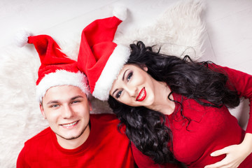 Christmas Couple.Happy Smiling Family at home celebrating