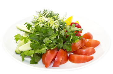 plate with fresh vegetables on a white background