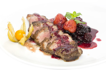 Peking duck with berry sauce on a white background