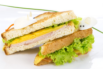 sandwich with ham and cheese, decorated eggs