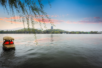 the west lake of hangzhou in sunset
