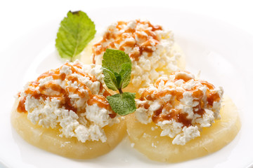 pineapple rings with fresh cheese and syrup
