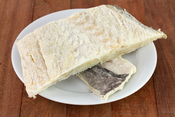 salted codfish on white plate