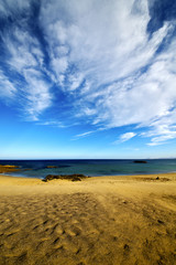 Fototapeta na wymiar footstep in lanzarote cloud beach water and summer