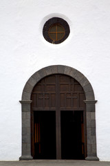 lanzarote  spain canarias     closed wood  church door and whit