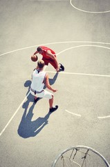 Two basketball players on the court