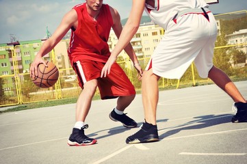 Two basketball players on the court