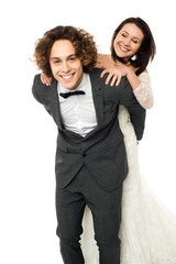 Bride enjoying piggyback ride