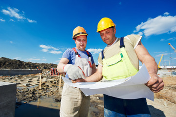 Engineers builders at construction site
