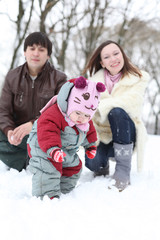 Happy family having fun on beautiful snowy