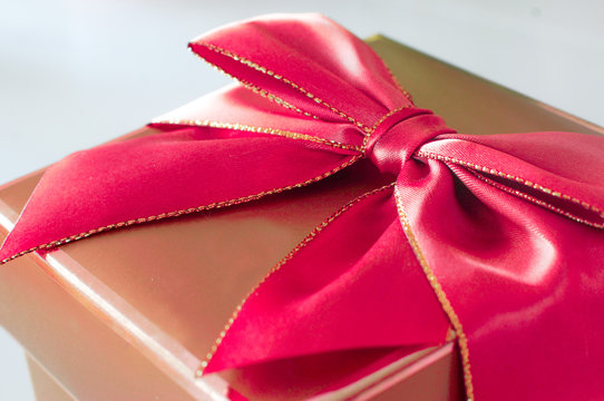 Gold Present With Red Bow -isolated