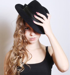 Beautiful young model in hat white background