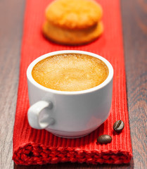Coffee cup and cookies on a table