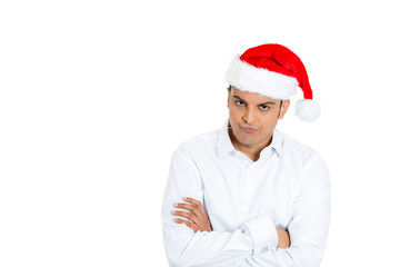 Portrait sad man in santa hat isolated over white background