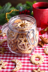 Fototapeta na wymiar Delicious Christmas cookies in jar on table close-up