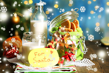 Fototapeta na wymiar Cookies and milk for Santa. in bright background