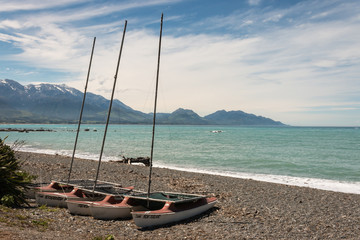 catamarans on pebbly beach