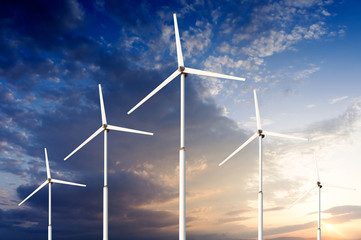 Green renewable energy concept - wind generator turbines in sky