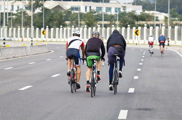 Group of cyclists  practice on the road