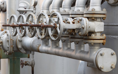 close-up of old gate valve on pipe connection