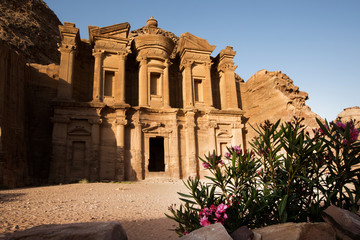 Monastery at Ancient city of Petra with flowers in front, Jordan
