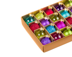 Box with Christmas decorations isolated on white background