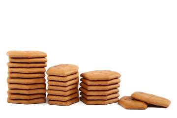 Stack of cracker biscuits on a white background.