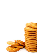 Stack of cracker biscuits on a white background.