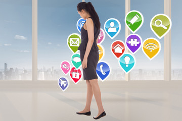 Composite image of asian businesswoman walking