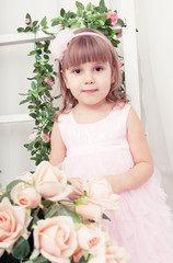 Obraz na płótnie Canvas beautiful girl in an elegant dress with flowers