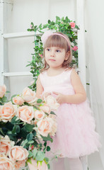beautiful girl in an elegant dress with flowers