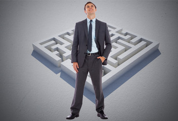 Composite image of happy businessman with hand in pocket