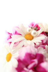 daisy and pink carnation with ear rings