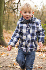 Boy playing in woods