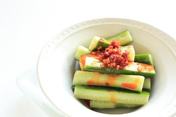 Japanese food, cucumber stick and rayu sauce