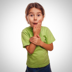 little girl surprised teenager feels joy holding hand on face is