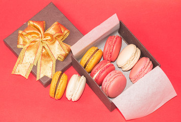 gift box full of colorful macarons
