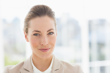Fototapeta premium Close-up portrait of a young businesswoman smiling