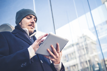 multitasking man using tablet, laptop and cellhpone © Eugenio Marongiu